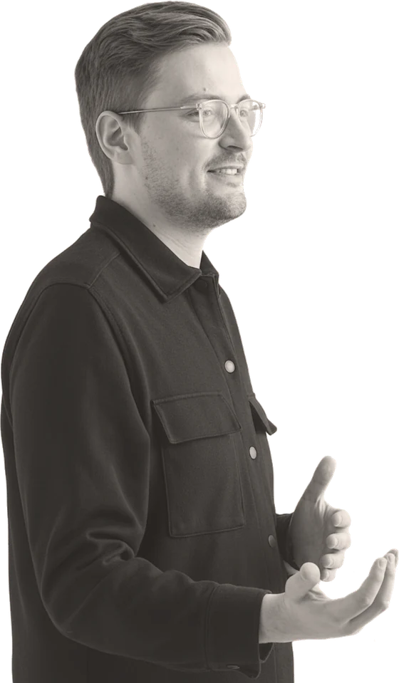 Karl Doose in mid-sentence, hands open